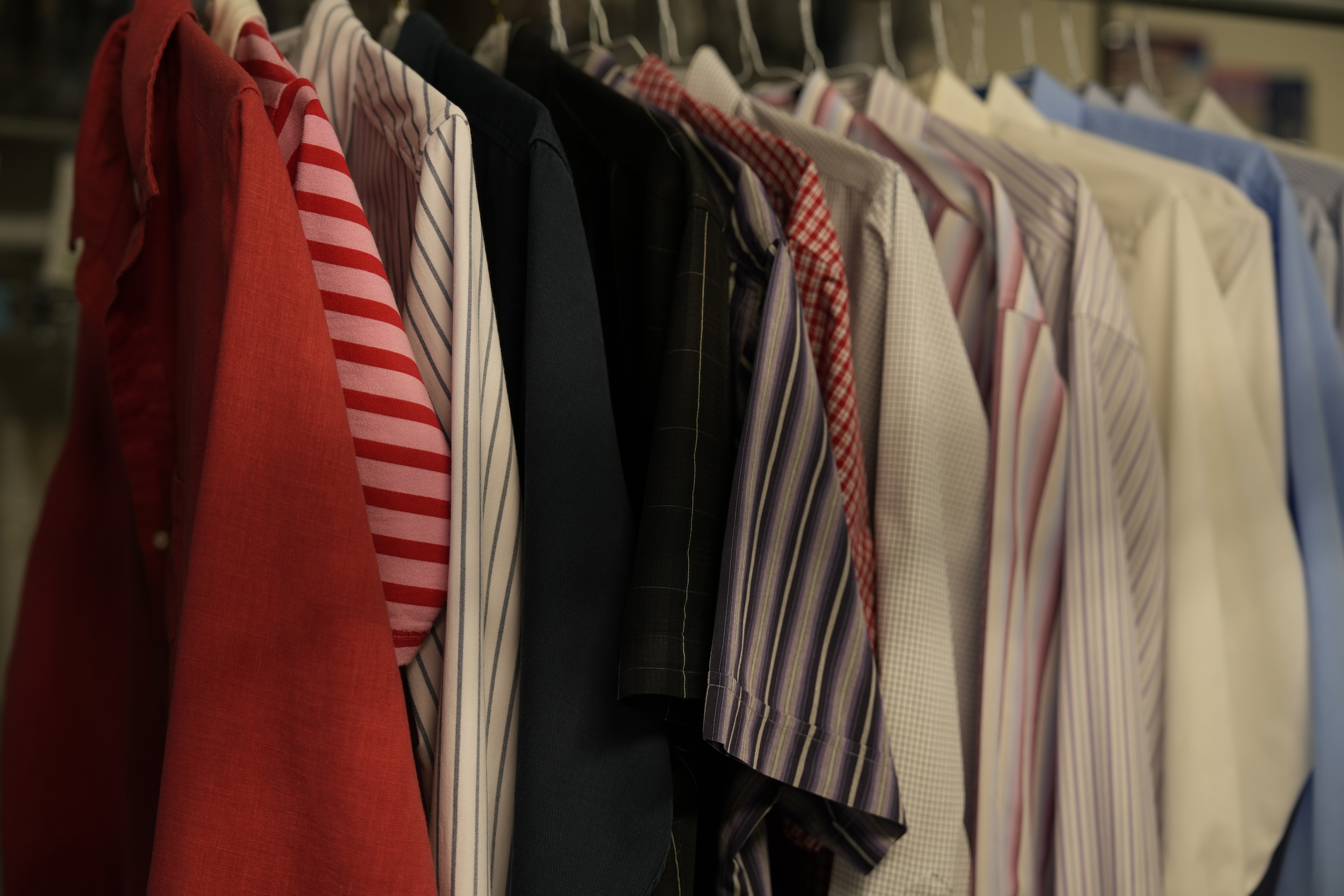 Colorful garments prepared for professional dry cleaning